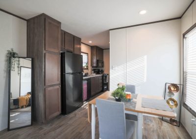 Model dining and kitchen at Aldea Manufactured Home Community in Fort Worth, Texas