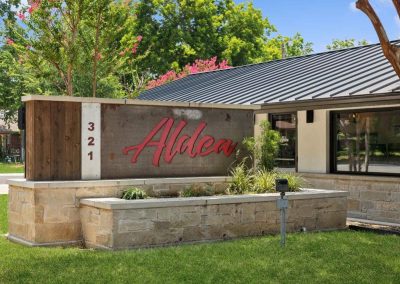 Community signage at Aldea Manufactured Home Community in Fort Worth, Texas